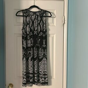 Light weight INC dress, some stretch. Very comfortable.